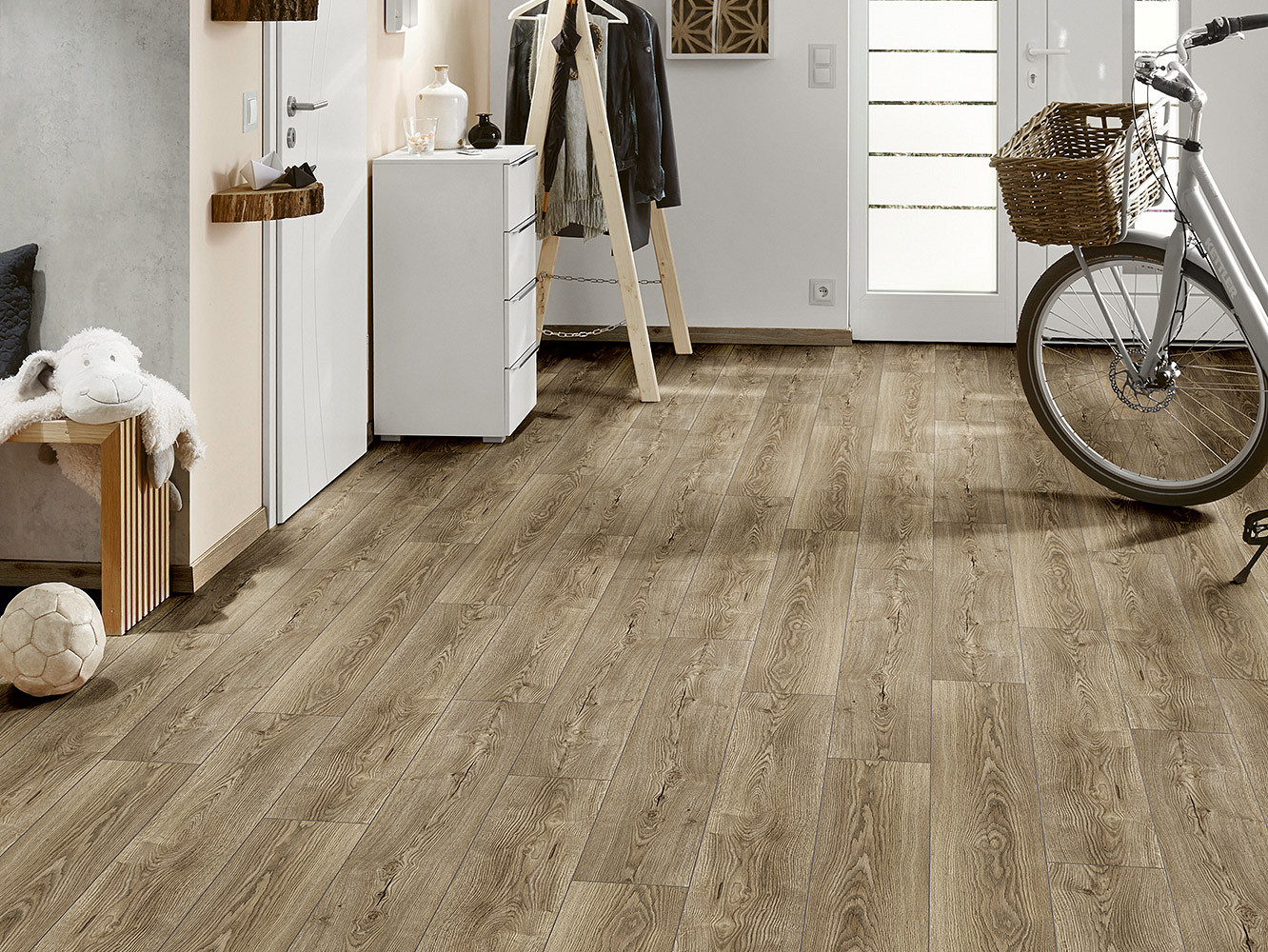 K482 Twiling Sterling Oak' flooring illuminating a well-lit room, creating a bright and airy ambiance with its silver-gray hues.