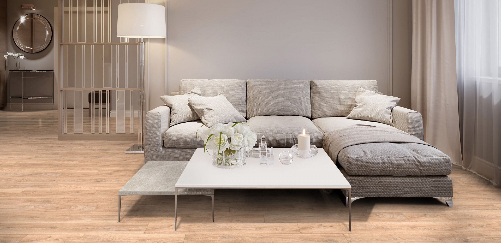 5947 Historic Oak' flooring in a spacious living room, contrasting with a large beige sofa and chic coffee table, blending comfort and style.