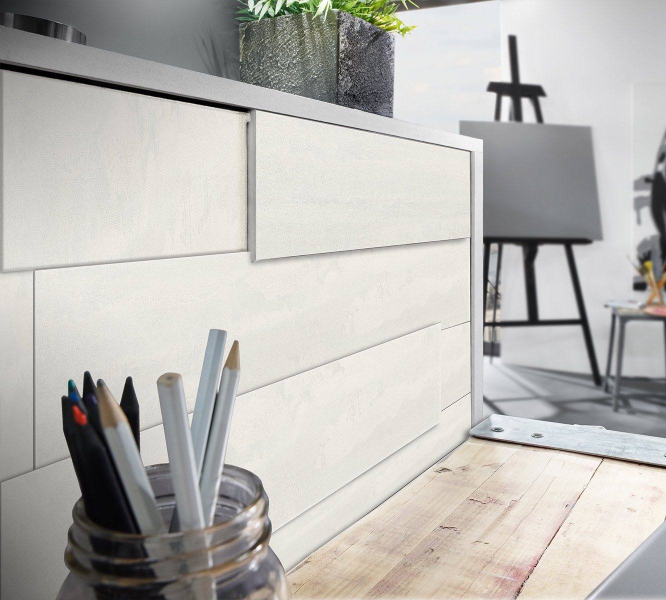 Image showing the striking contrast between the icy hues of the K385 Ice Flow Wall Panel Laminate Flooring and the warm-colored room decor.