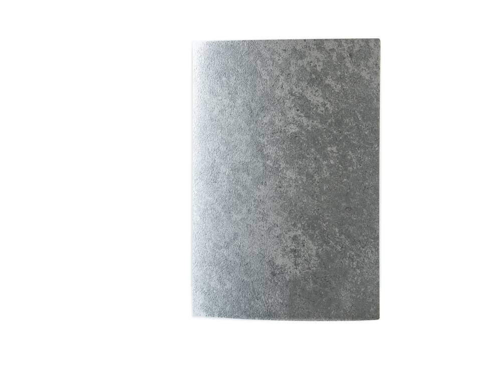 Close-up image of the K207 Grey Galaxy RS product, showcasing its cool grey color and a texture reminiscent of a starry night sky.