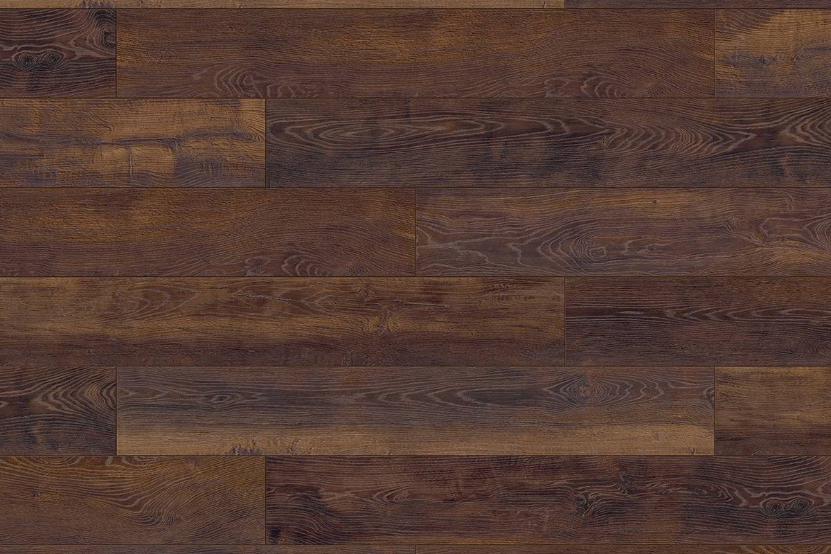 Close-up of K414 Corsair Oak laminate flooring, showing detailed oak-like grain and warm tones