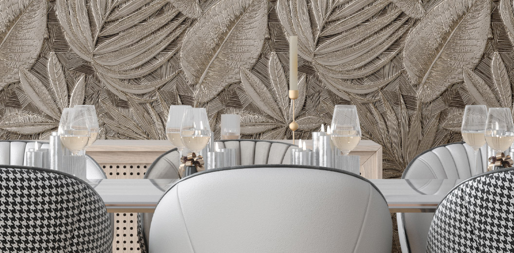 Modern dining room with decorative wall featuring embossed leaves and elegant chairs