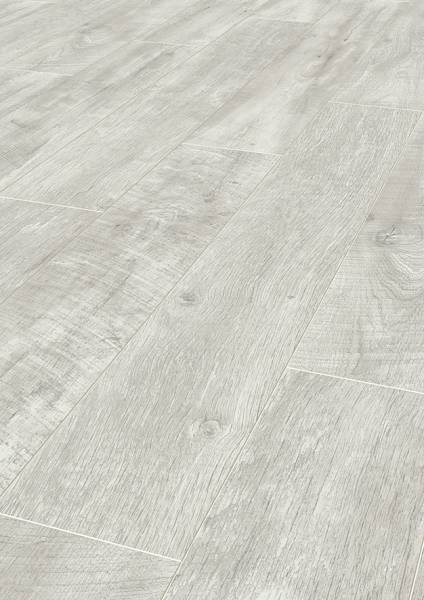 Close-up showcasing the subtle textures and light tones of the K060 Alabaster Barnwood laminate flooring.